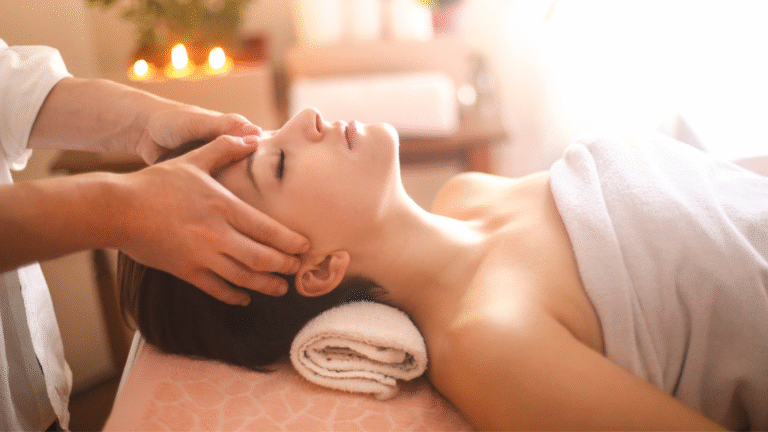 Client receiving a soothing spa massage on a massage table with calm lighting