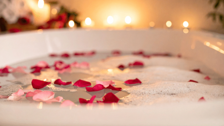 Close up of a bath with flower petals on water