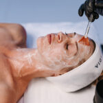 Woman receiving a calming spa face mask in a treatment room