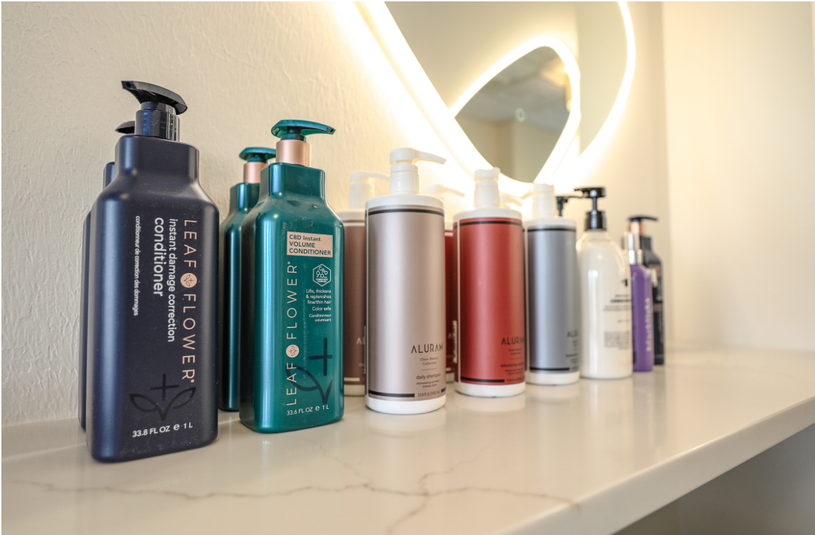 assortment of fancy shampoo and conditioners